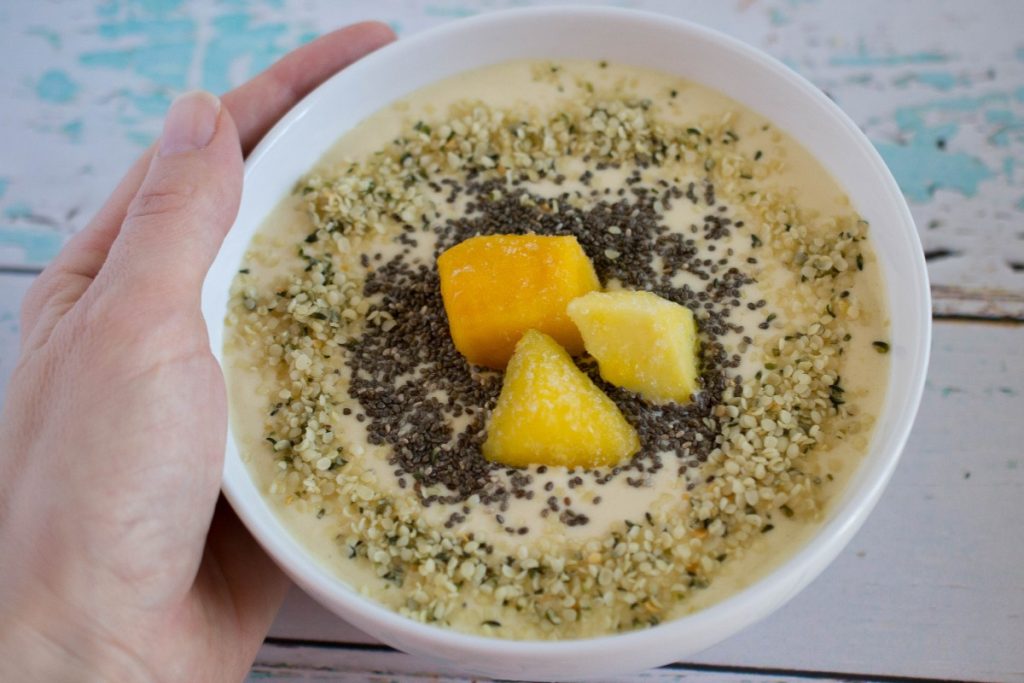 You almost feel like you're on a tropical island with this Mango Peach Smoothie Bowl! It's a subtly sweet way to start off your morning in a healthy way!