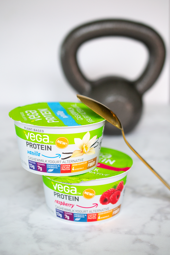 Vega Protein Cashewmilk Yogurt Alternative with a kettlebell